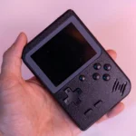 Nintendo Switch handheld console with games being played
