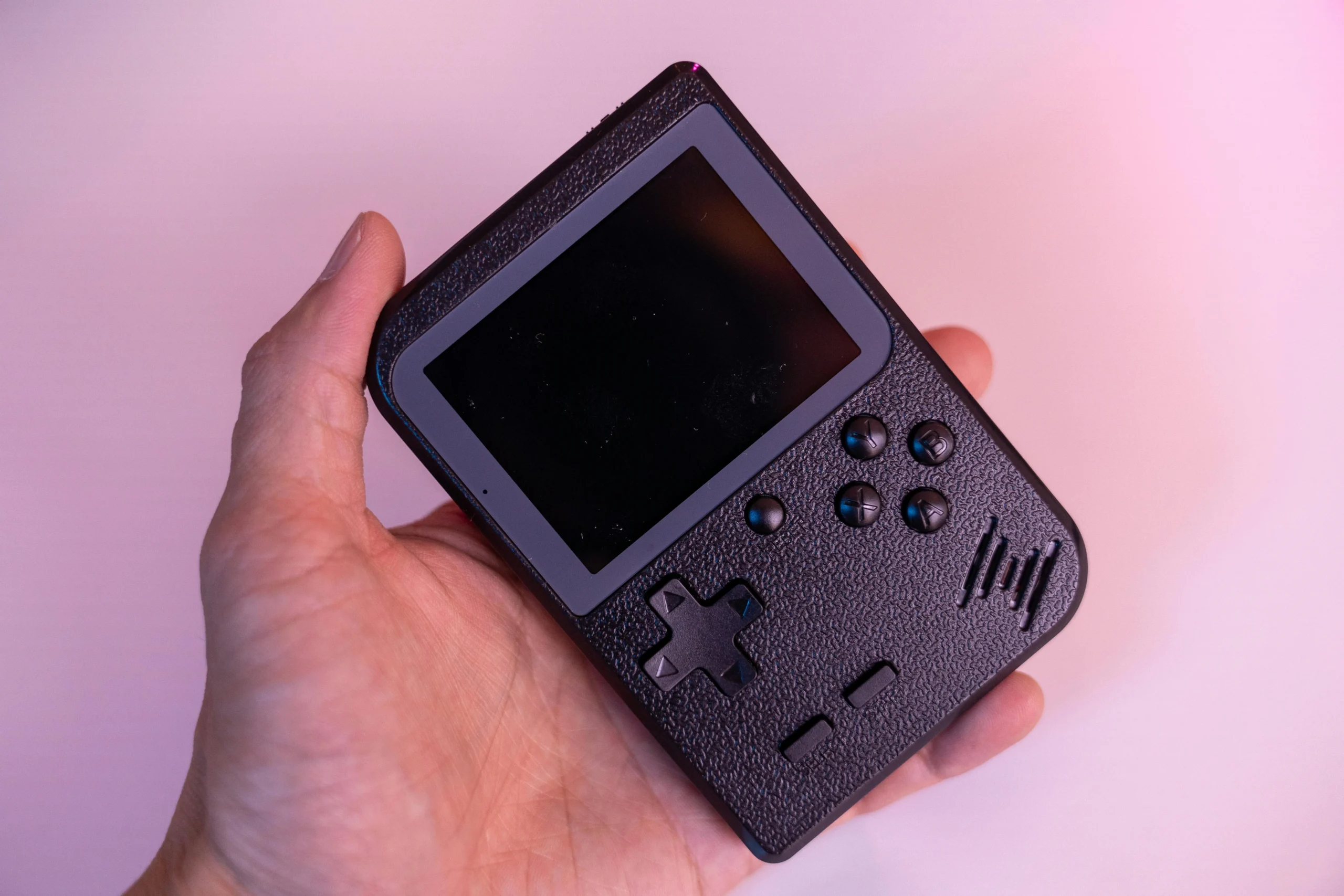 Nintendo Switch handheld console with games being played